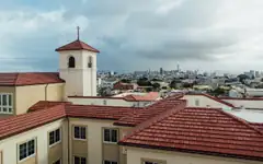 Lone Mountain East residence hall at the University of San Francisco, with the city behind
